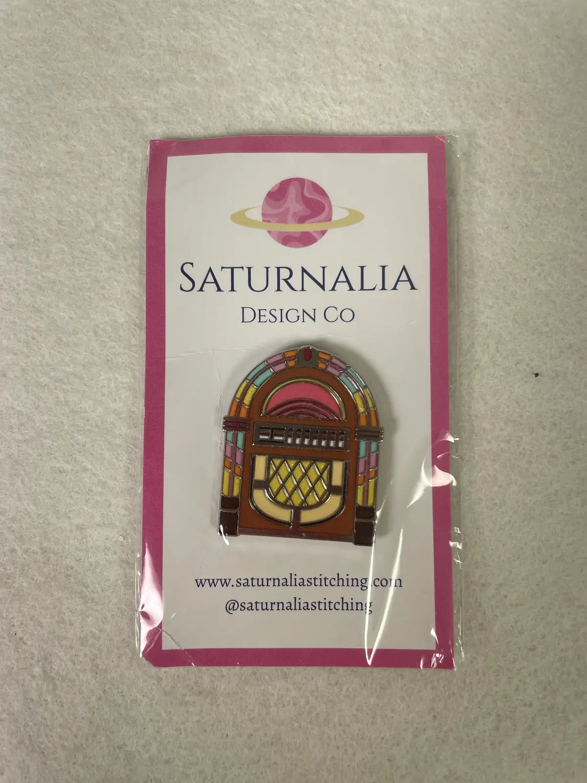 * Saturnalia Stitching Juke Box Needleminder 1
