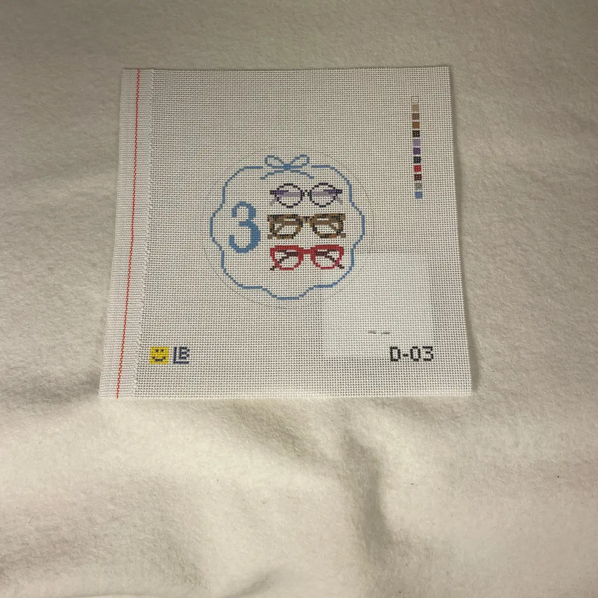 * Lauren Bloch  D03- 12 Days Of Needlepoint- Three Spectacles 1